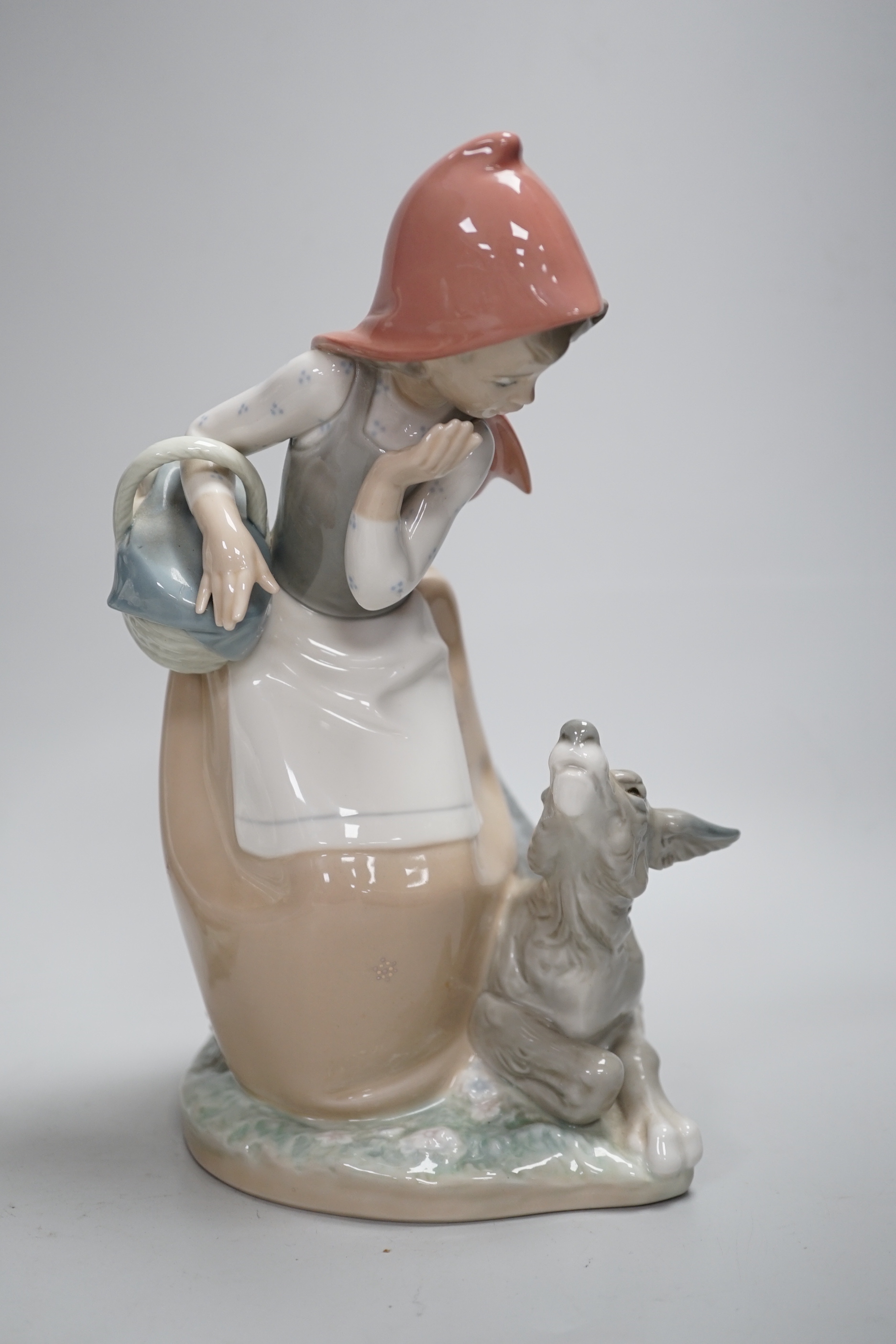 Four Lladro models, a girl potter, girl with ducks, mother and child with pottery and girl with a dog, highest 23.3cm